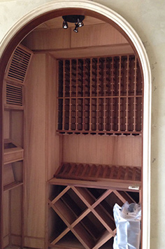 empty wine cellar, wine cellar, custom wood work, import wine, cooling system, diamond shape cubby, aabc wine cellar, stacks of wine, prebuilt, phase building,