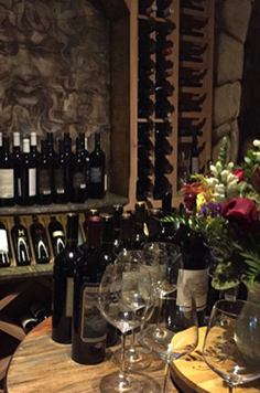 custom wine cellar, home wine cellar, greek god, pagan god, red wine, flowers vase, wine glass, wine storage, home wine storage, aging wine